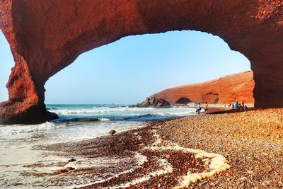 Scenic view of beach against clear sky