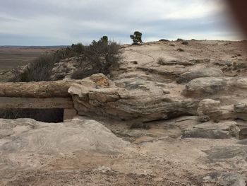 Rock formation on land against sky
