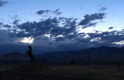 Scenic view of silhouette mountain against sky