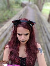 Close-up of hipster woman looking away outdoors