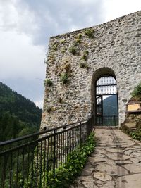 View of old building against cloudy sky