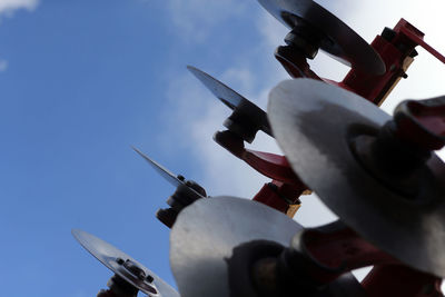 Low angle view of airplane flying against sky