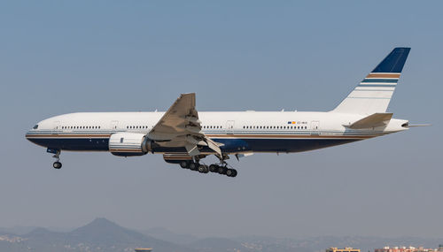 Low angle view of airplane flying against clear sky