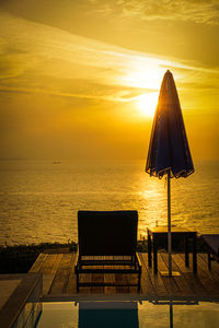 Sunset in crete - pool, lounger and sunshade