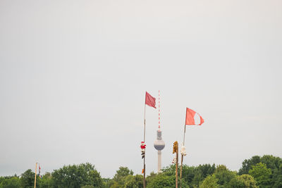 Low angle view of american flag against sky