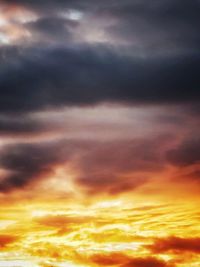 Low angle view of dramatic sky during sunset