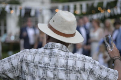 Rear view of man wearing hat