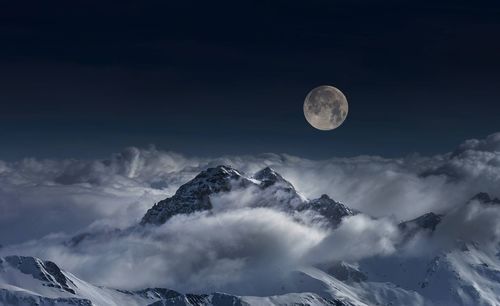 Full moon above the clouds