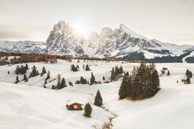 Scenic view of snow covered mountains against sky