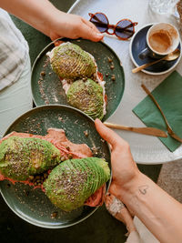 High angle view of women holding food