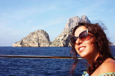 Closeup of brunette caucasian girl on vacation in ibiza in summer in front of esvedra