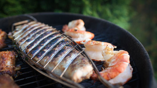 Close-up of meat on barbecue grill