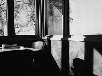 Chairs and table by window