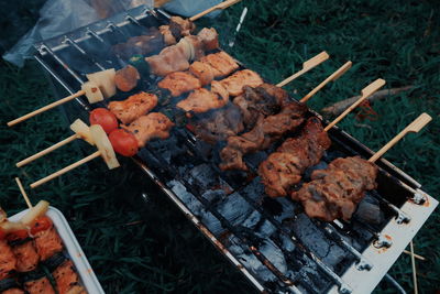 High angle view of meat on barbecue grill