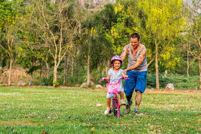 Daughter and father on field