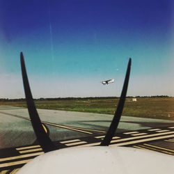 Airplane flying over landscape