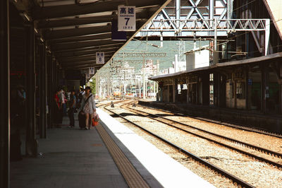 Man waiting at railroad station