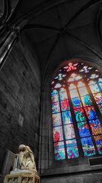 Low angle view of glass window in building