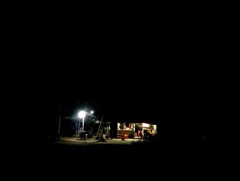 Illuminated car against sky at night