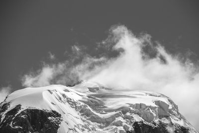 Scenic view of snowcapped mountain against sky