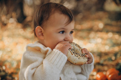 Close-up of cute girl eating food