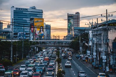 Traffic on city street during sunset