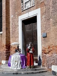 Portrait of woman in front of window