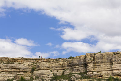 Low angle view of rock formations against sky