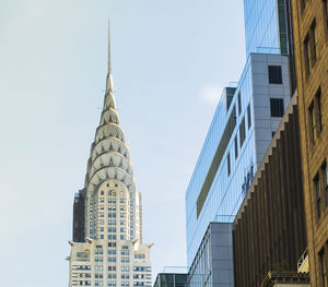 Low angle view of skyscrapers against clear sky