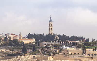 Buildings in city against sky