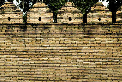 Low angle view of brick wall
