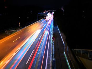 High angle view of light trails on city street at night