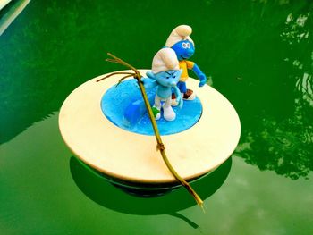 High angle view of toy floating on swimming pool