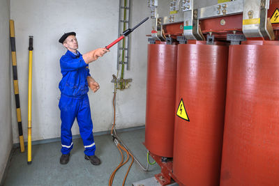 Full length of man working in building