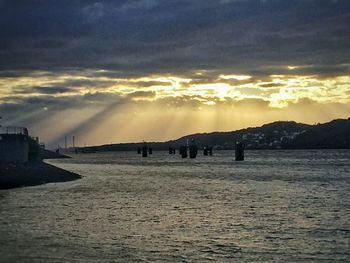 Scenic view of sea against cloudy sky