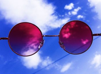 Low angle view of sunglasses against sky