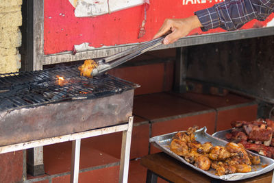 High angle view of meat on barbecue grill