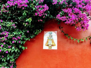 Wall in spain with flowers and tile of saint