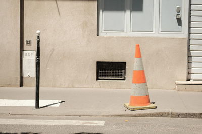 Closed window on street against building in city