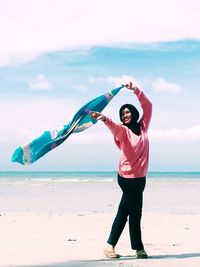 Woman standing on beach