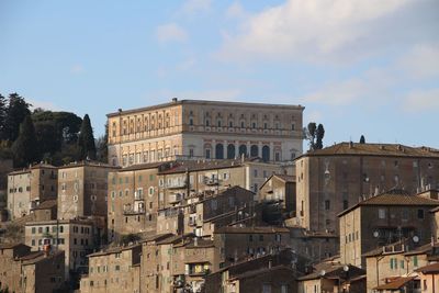 Buildings in city against sky