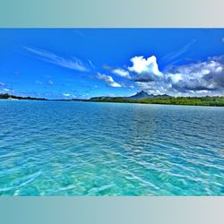 Scenic view of sea against cloudy sky