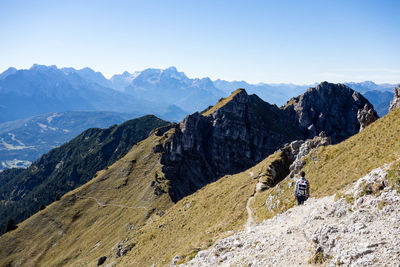 Scenic view of mountains against clear blue sky