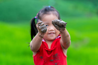 Happy girl very fun play mud