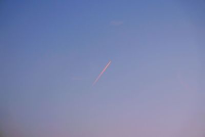 Low angle view of vapor trails in sky