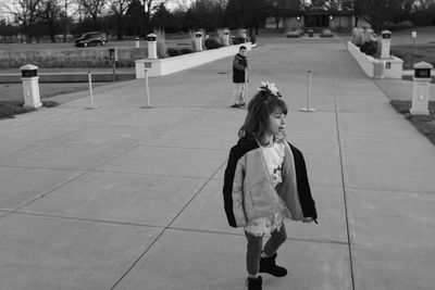 Girl standing on road