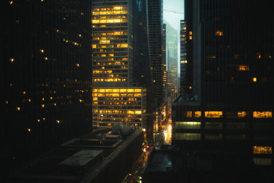 Illuminated buildings in city at night