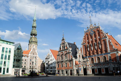 Low angle view of clock tower in city