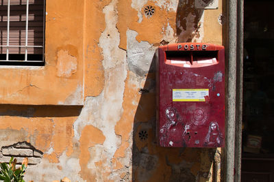 Close-up of mailbox on old building