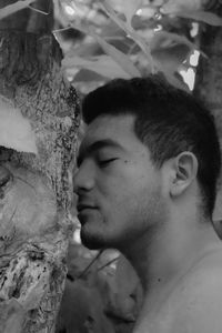 Close-up portrait of young man looking away